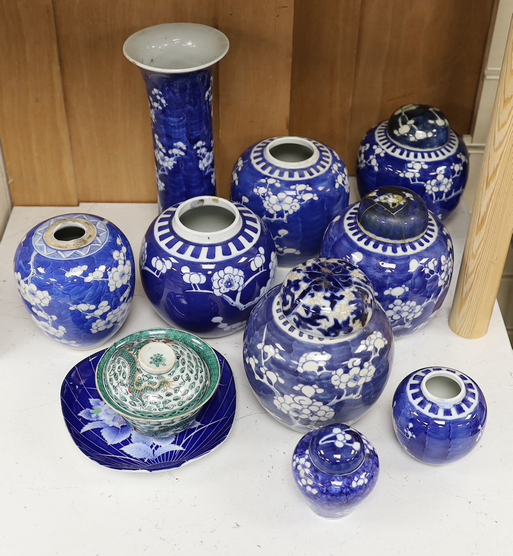 Eight Chinese blue and white ginger jars, one prunus vase and two others, the vase 25 cm high